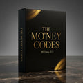 Hochwertige schwarze Buchbox mit goldgeprägtem Titel 'THE MONEY CODES und goldenen Designelementen